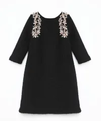 vestido corto negro de baguilla de lana con lazos adorno chanel