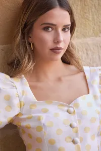 Conjunto top y falda abullonado de lunares amarillo
