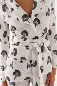 Chaqueta de lentejuelas blanca y negra para invitada