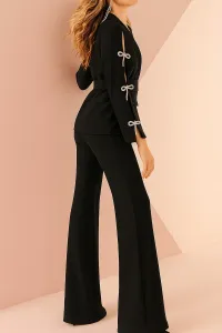 Traje chaqueta y pantalón negro lazos joya Leonor