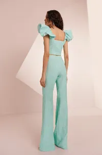Top con volante en el hombro brocado aguamarina Zooey