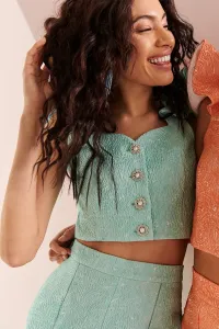 Top con volante en el hombro brocado aguamarina Zooey