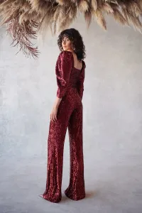 conjunto de top corto con boton joya y manga jamon y pantalon en
