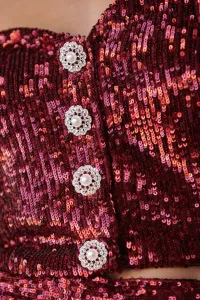 conjunto de top corto con boton joya y manga jamon y pantalon en