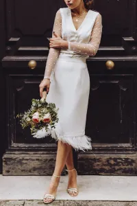 Conjunto de novia con falda midi con plumas y blusa de plumetti