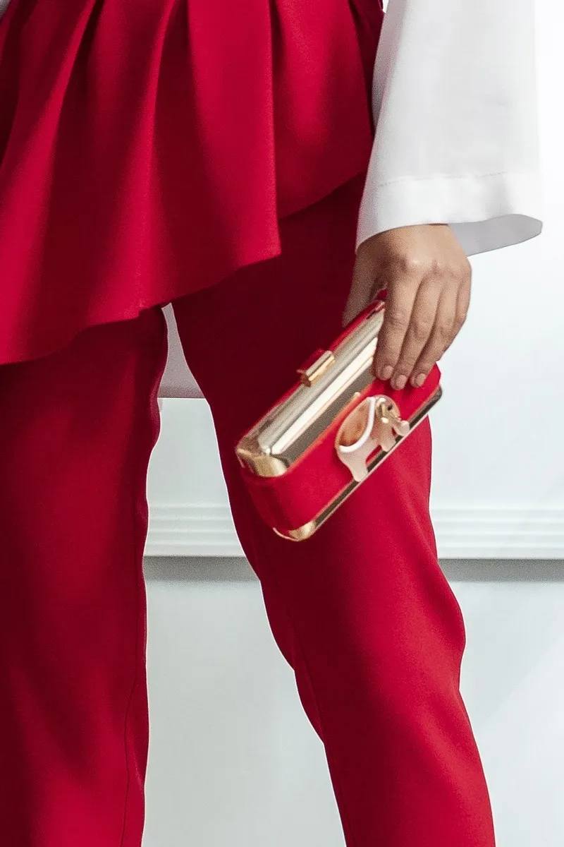 Bolso dorado con terciopelo rojo y elefante rojo