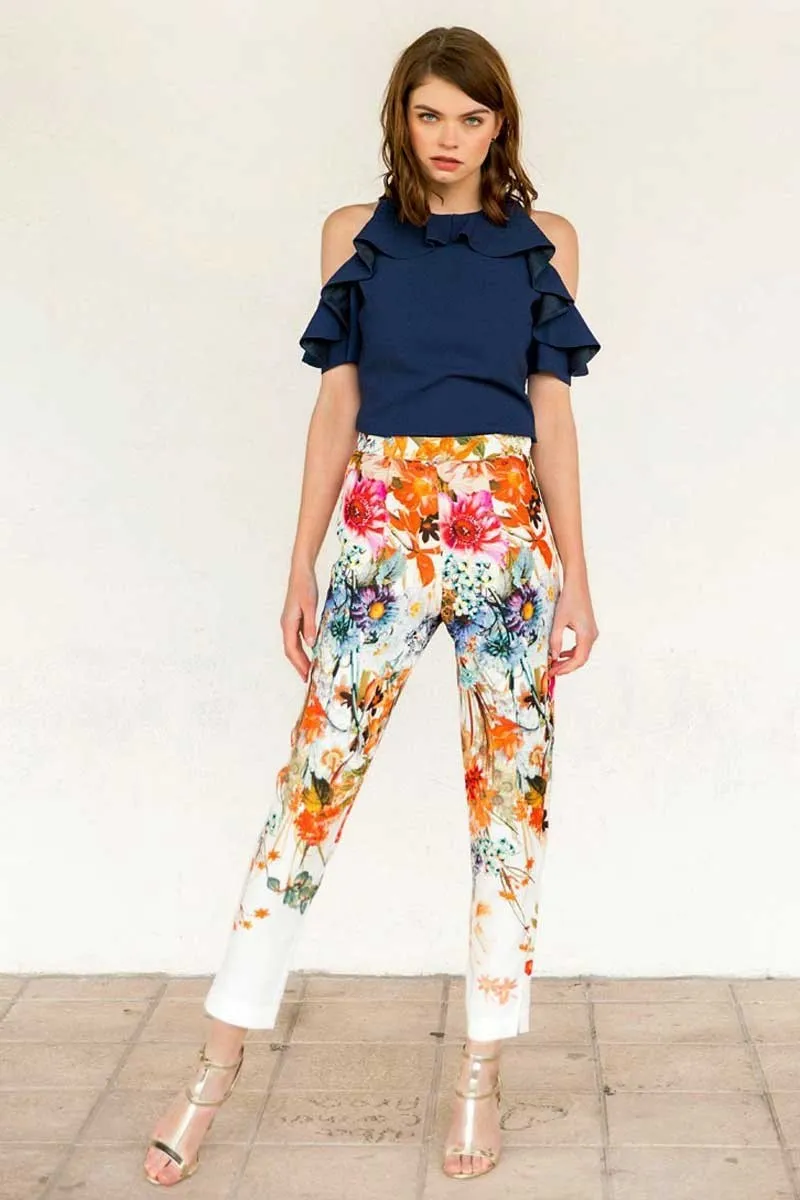 Pantalon pitillo ajustado blanco estampado flores colores tobillo