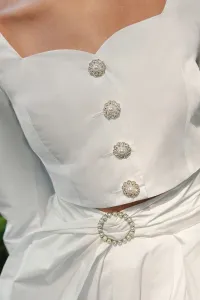 Top joya de tafetan blanco con manga abullonanda